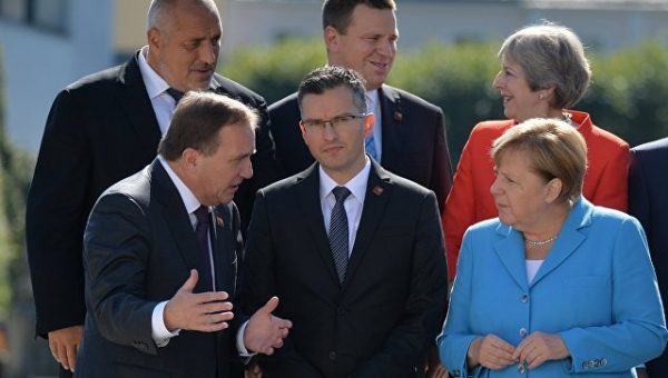 Меркель пренебрегла приветствием Мэй, пишет Daily Express